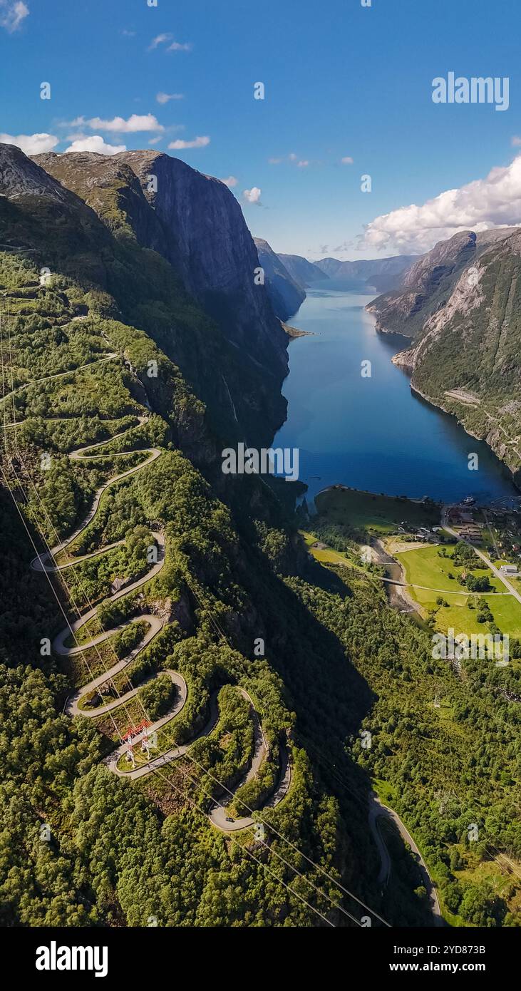 Lysebotn, Lysefjorden, Norway, An aerial view of a winding road cutting through the lush green mountains of Norway, with a stunn Stock Photo