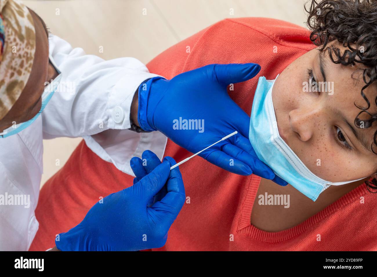 Young boy taking a PCR test. Stock Photo