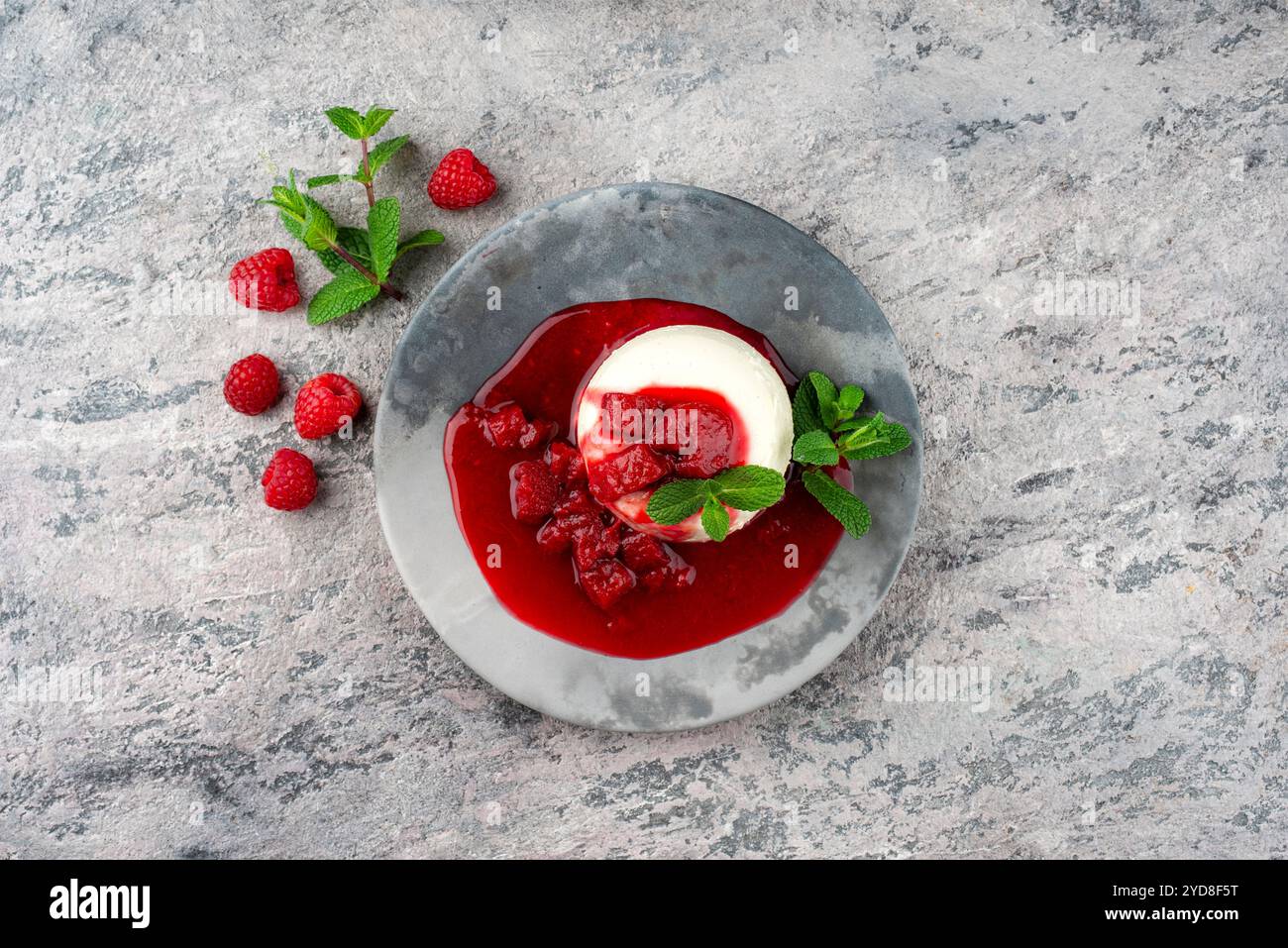 Traditional quark mousse with rhubarb and raspberry compote served as ...