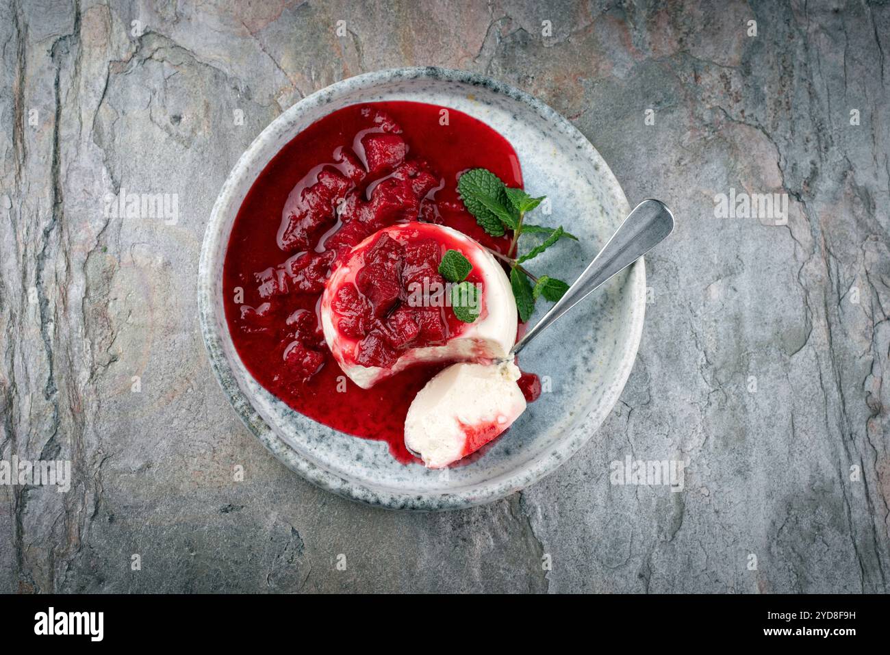Traditional quark mousse with rhubarb and raspberry compote served as ...