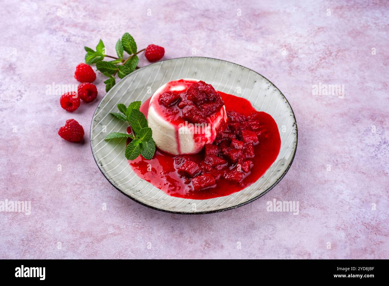 Traditional quark mousse with rhubarb and raspberry compote served as ...