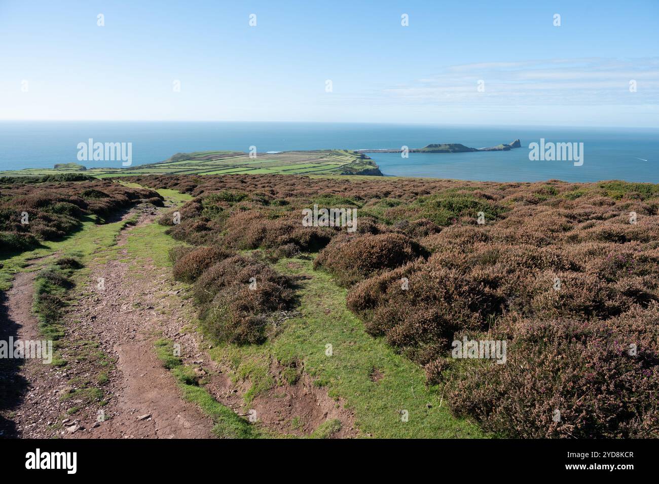 Path leading down from The Beacon and view of Rhossili and Worms Head ...