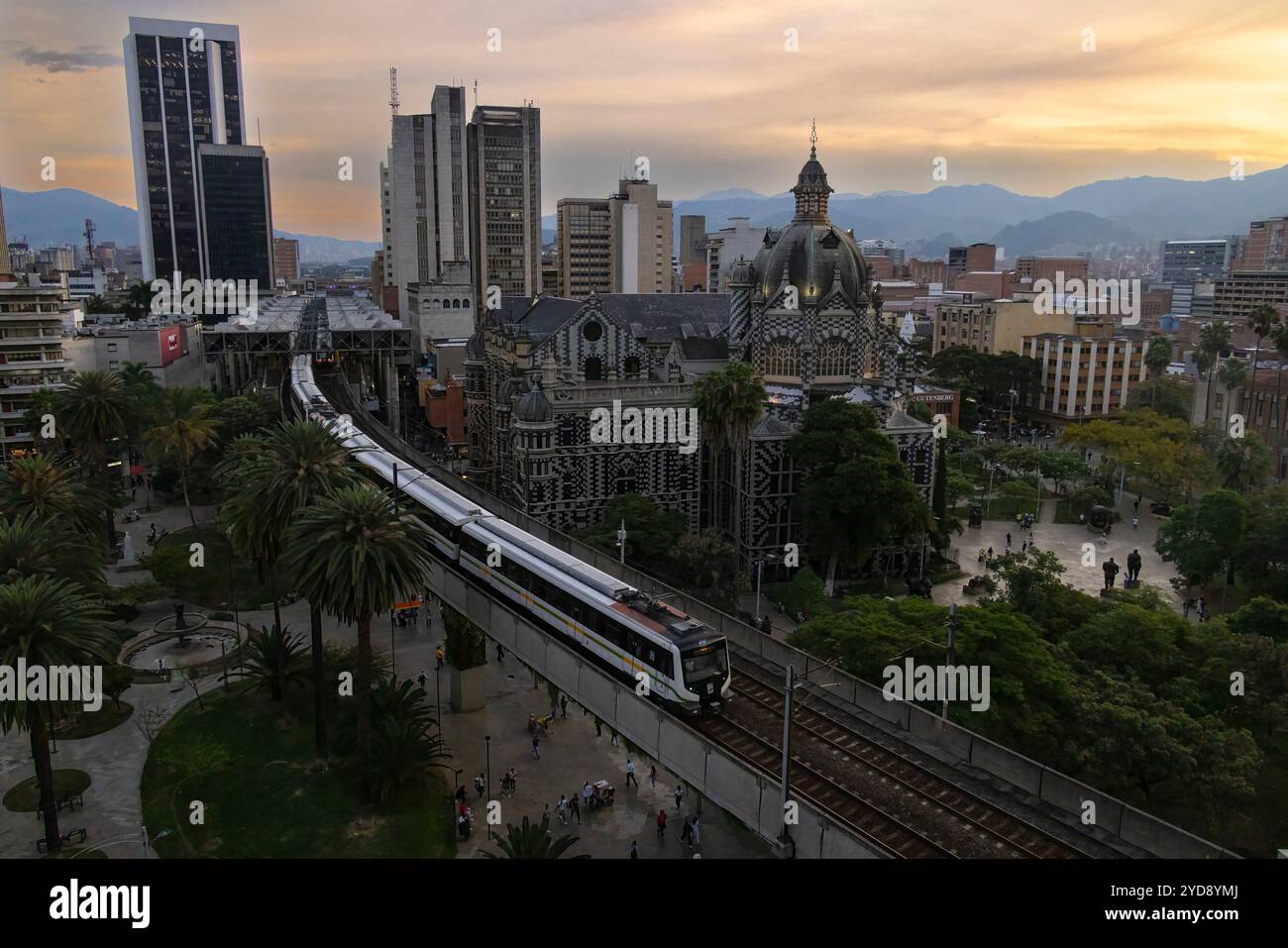 View of Plaza Botero and the famous metro system Medellin, Colombia. The metro includes street level trains and even aerial cable cars to connectthe c Stock Photo