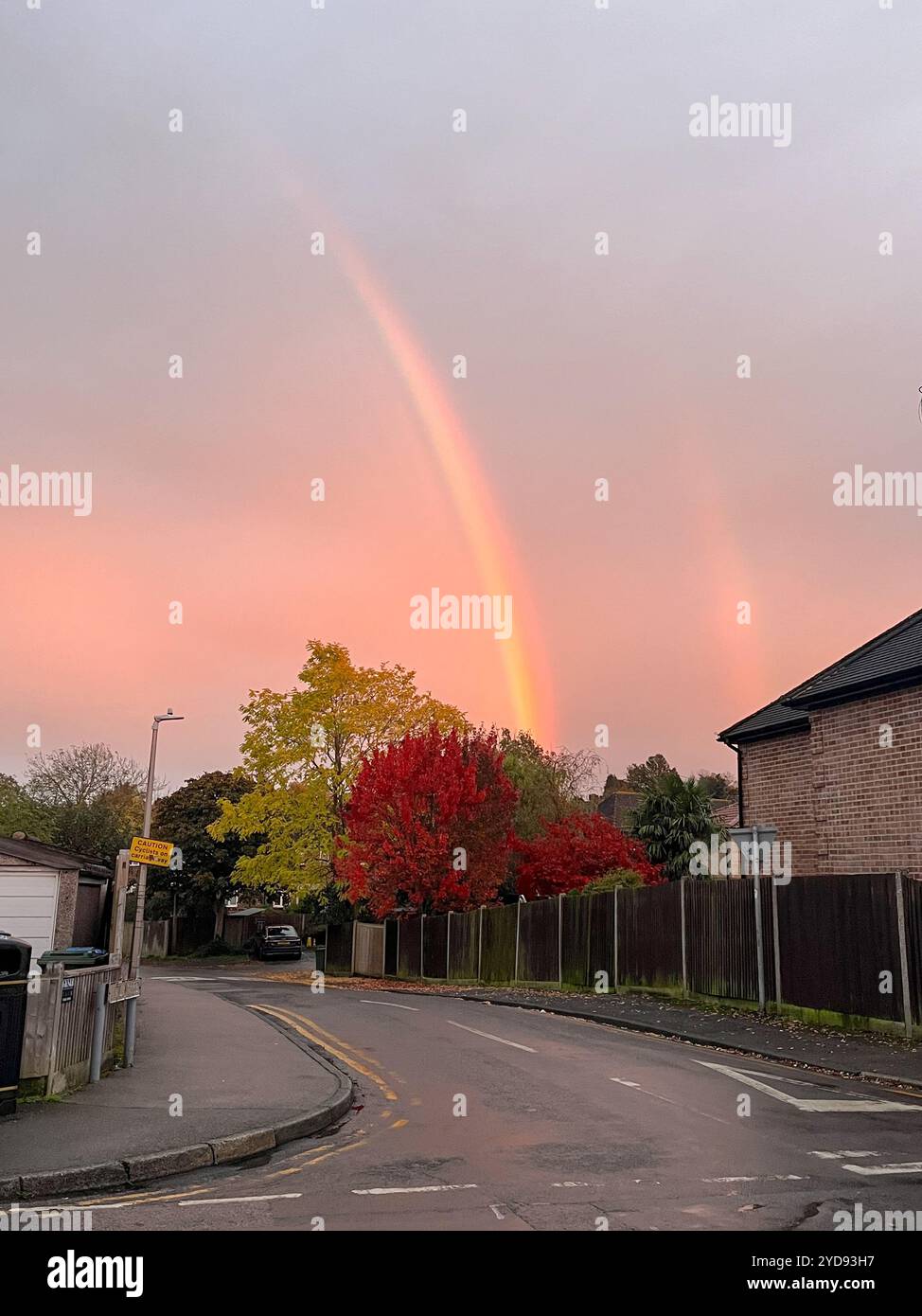 Kent, UK. 21st October 2024. Double rainbow appeared in the sky viewed from Sevenoaks, facing east in a residential road. England UK - Smartphone Captured Stock Image
