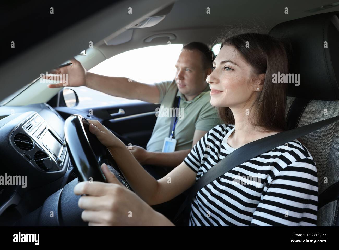 Driving school. Student passing driving test with examiner in car Stock ...