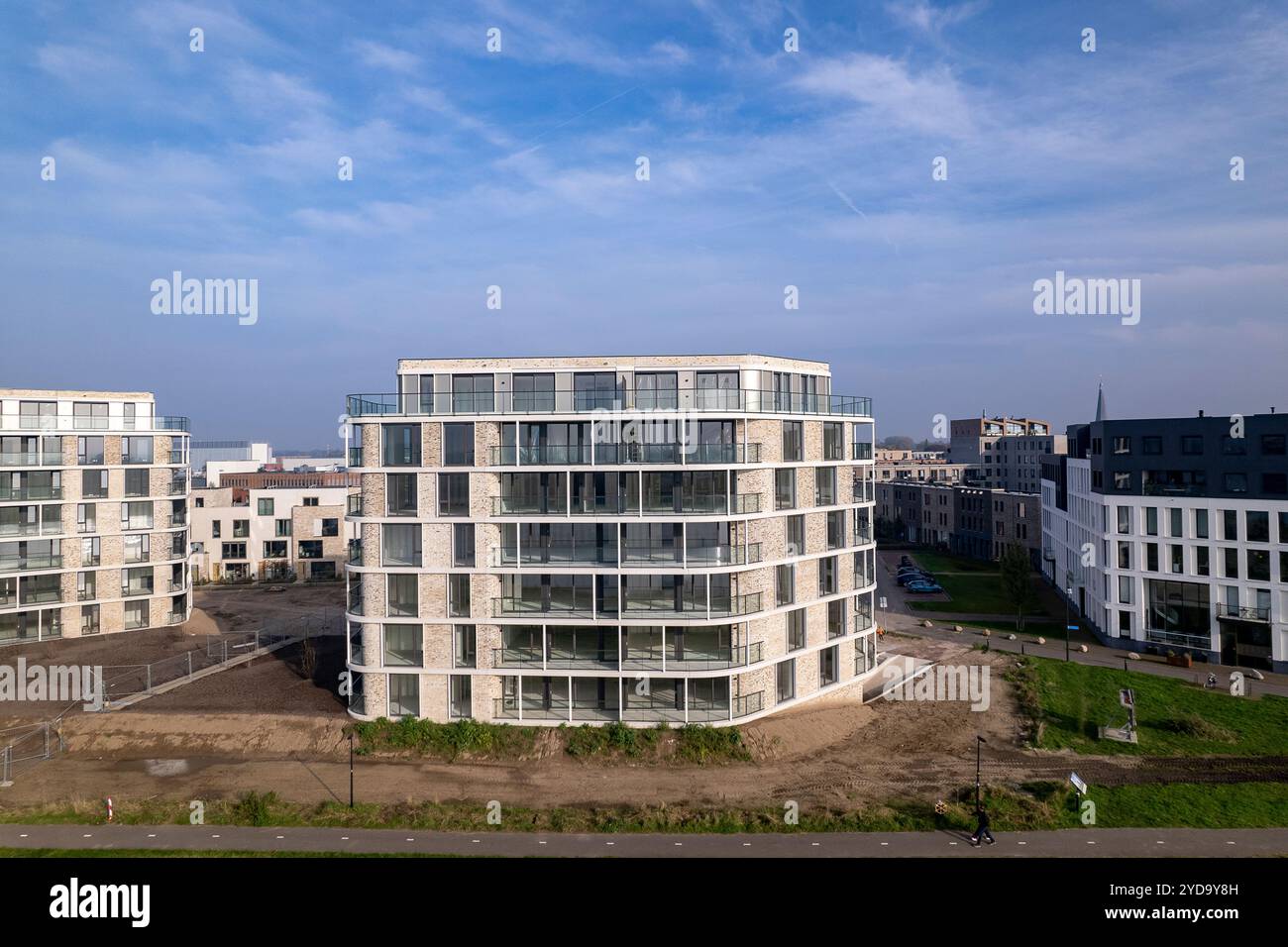 Aerial rising exterior facades of newly build luxury apartment towers ...