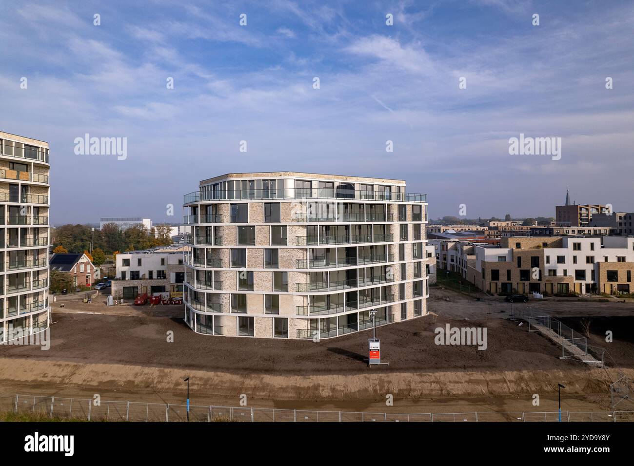 Aerial rising exterior facades of newly build luxury apartment towers ...