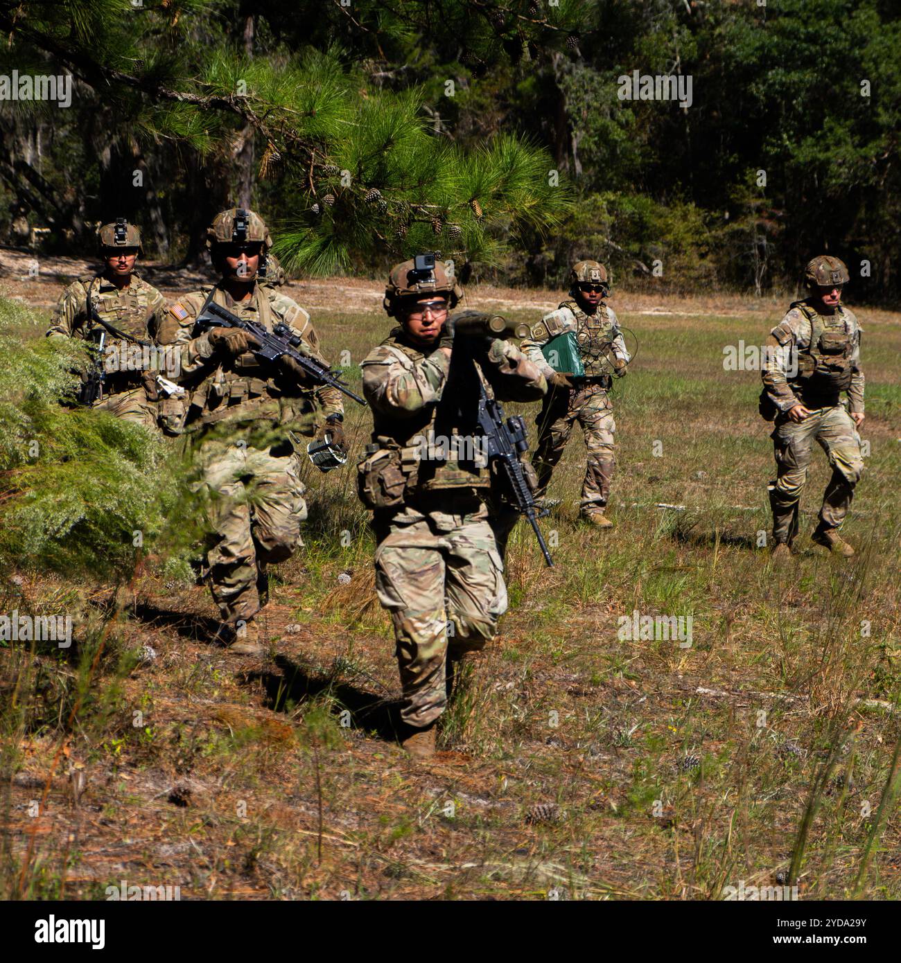 U.S. Army Soldiers assigned to 9th Engineer Battalion, 2nd Armored Brigade Combat Team, 3rd Infantry Division move to their defensive position before Stock Photo