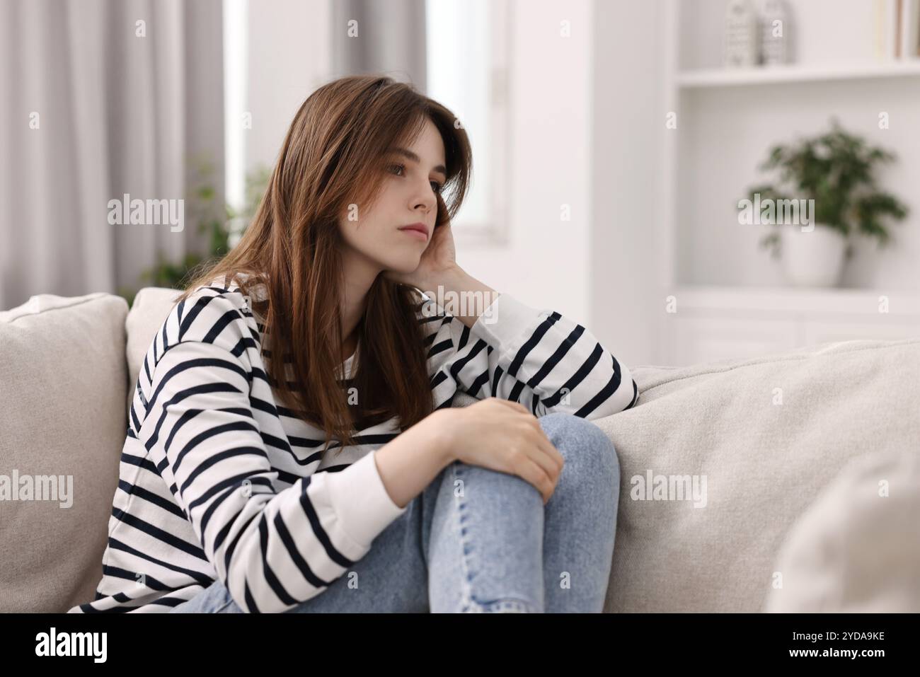 Loneliness concept. Sad teenage girl on sofa at home Stock Photo - Alamy