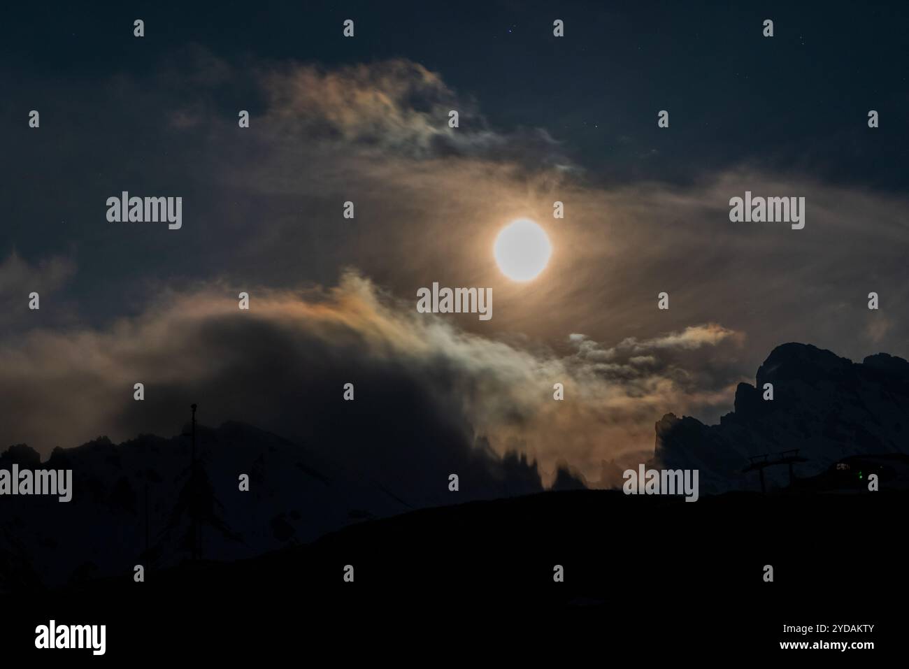 Full moon and starry sky in the Dolomites in South Tyrol, Italy. Stock Photo