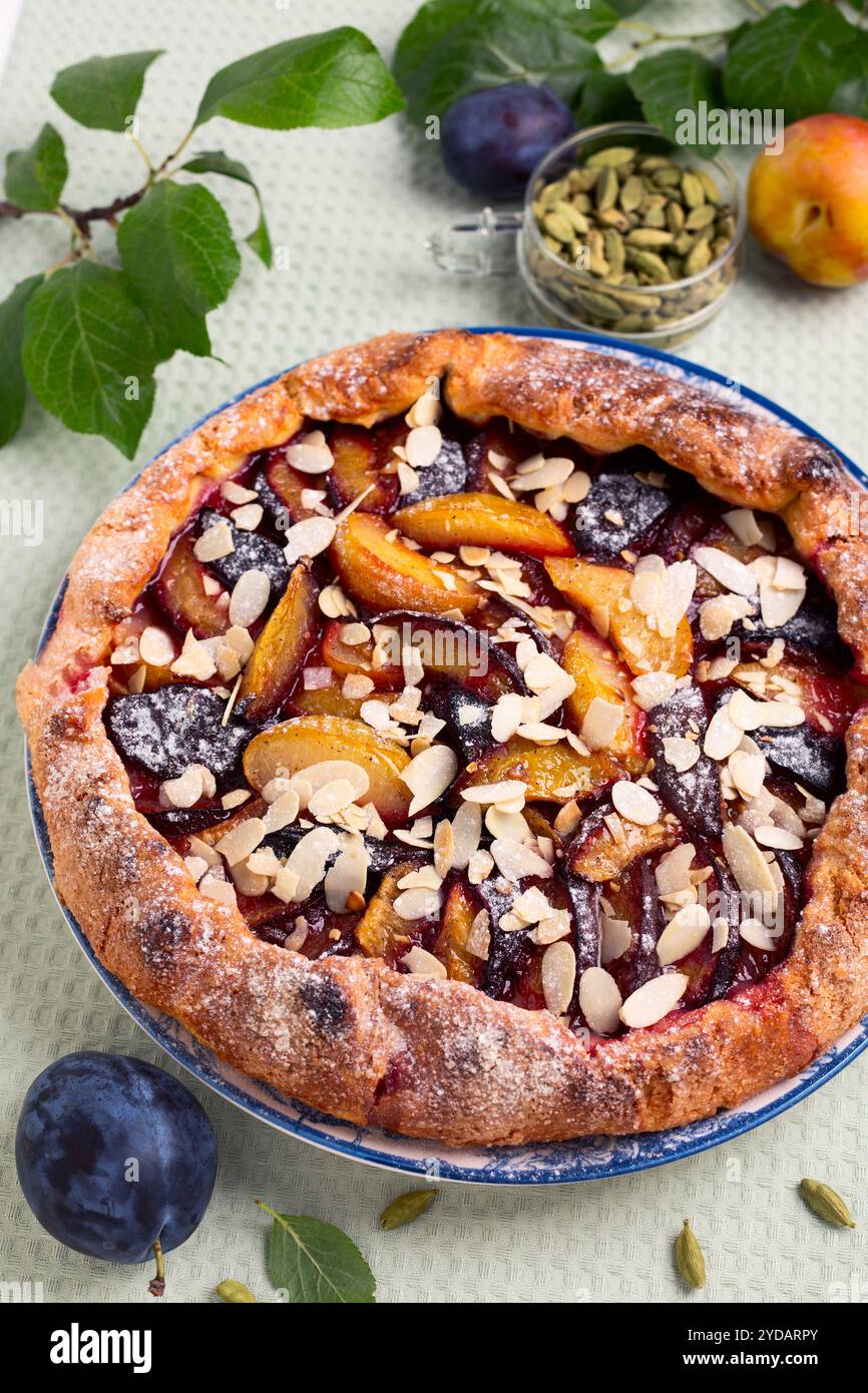 Homemade open pie (galette) with plums Stock Photo - Alamy