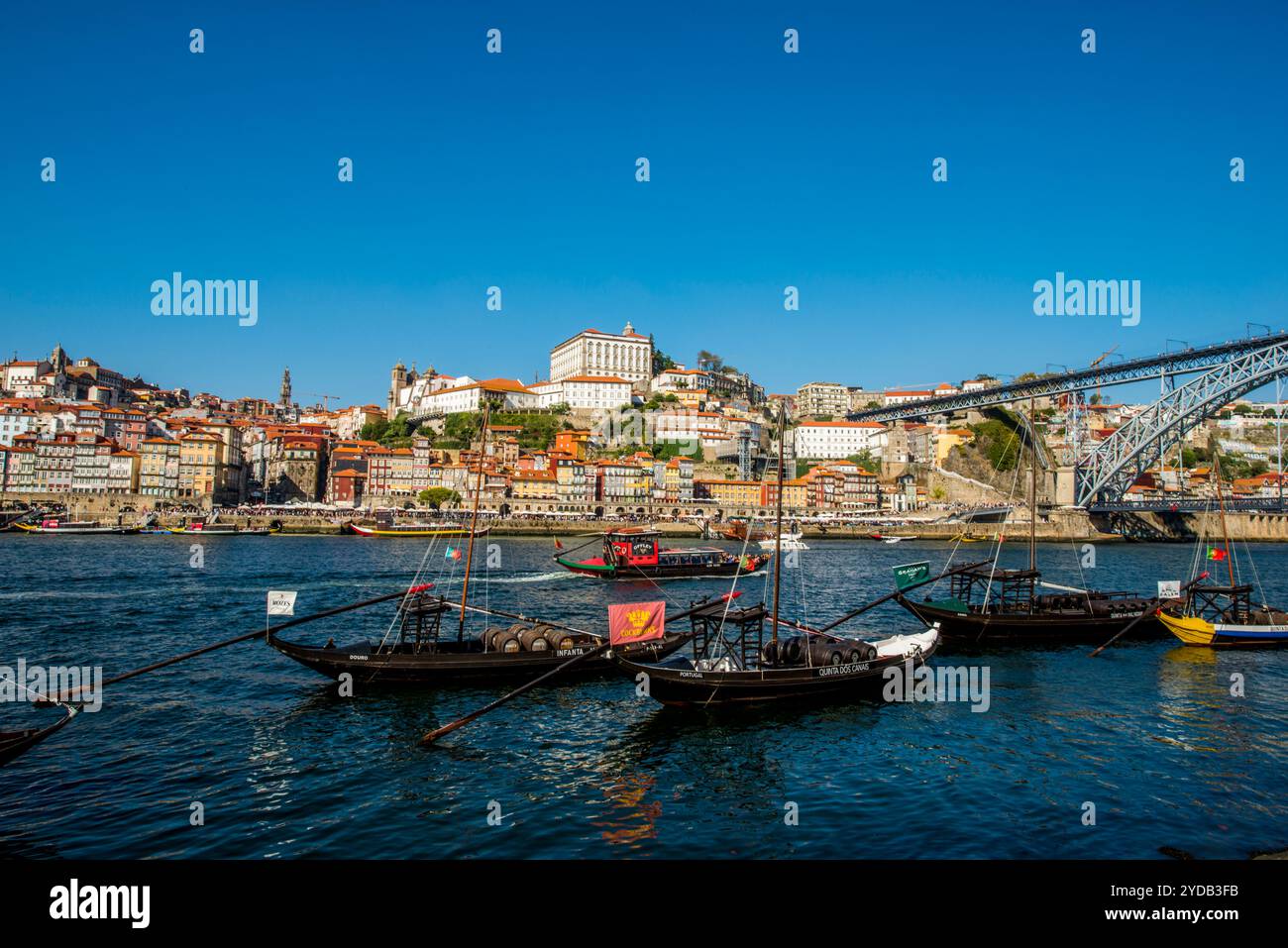 Rabelo boats near the Dom Luís I Bridge or Luís I Bridge over the Douro River, Porto, Portugal. Stock Photo