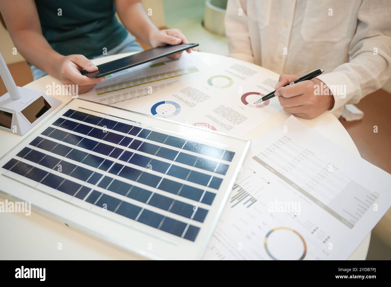 Solar panels green energy business people working in green eco friendly