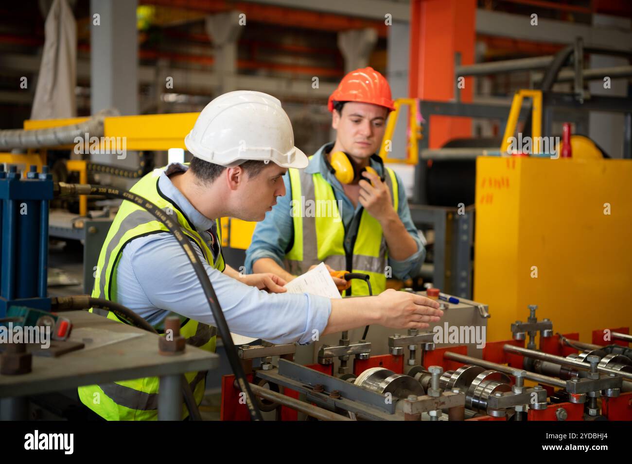 Two caucasian male production engineers hi-res stock photography and ...