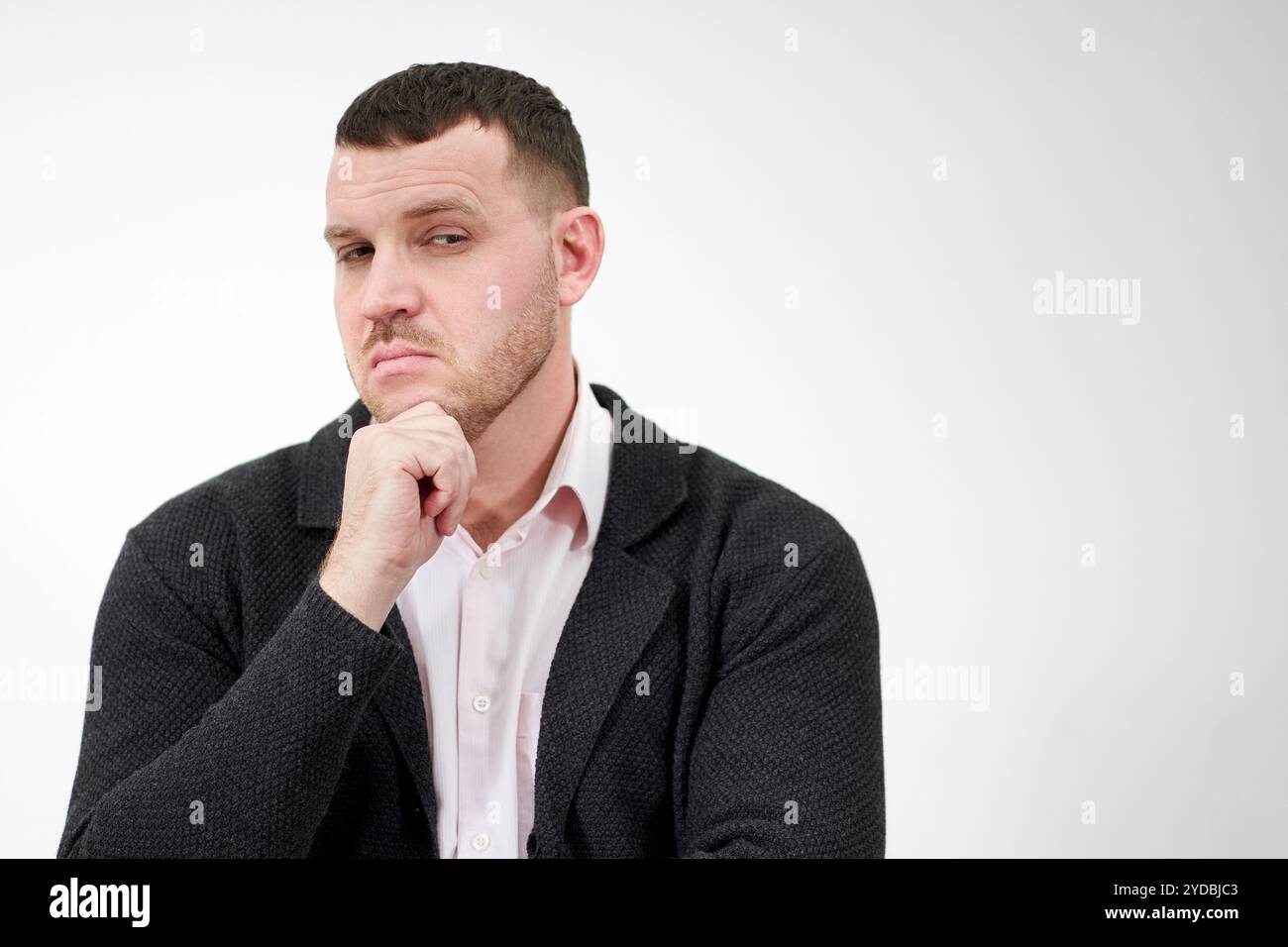 Handsome pensive young man hi-res stock photography and images - Alamy
