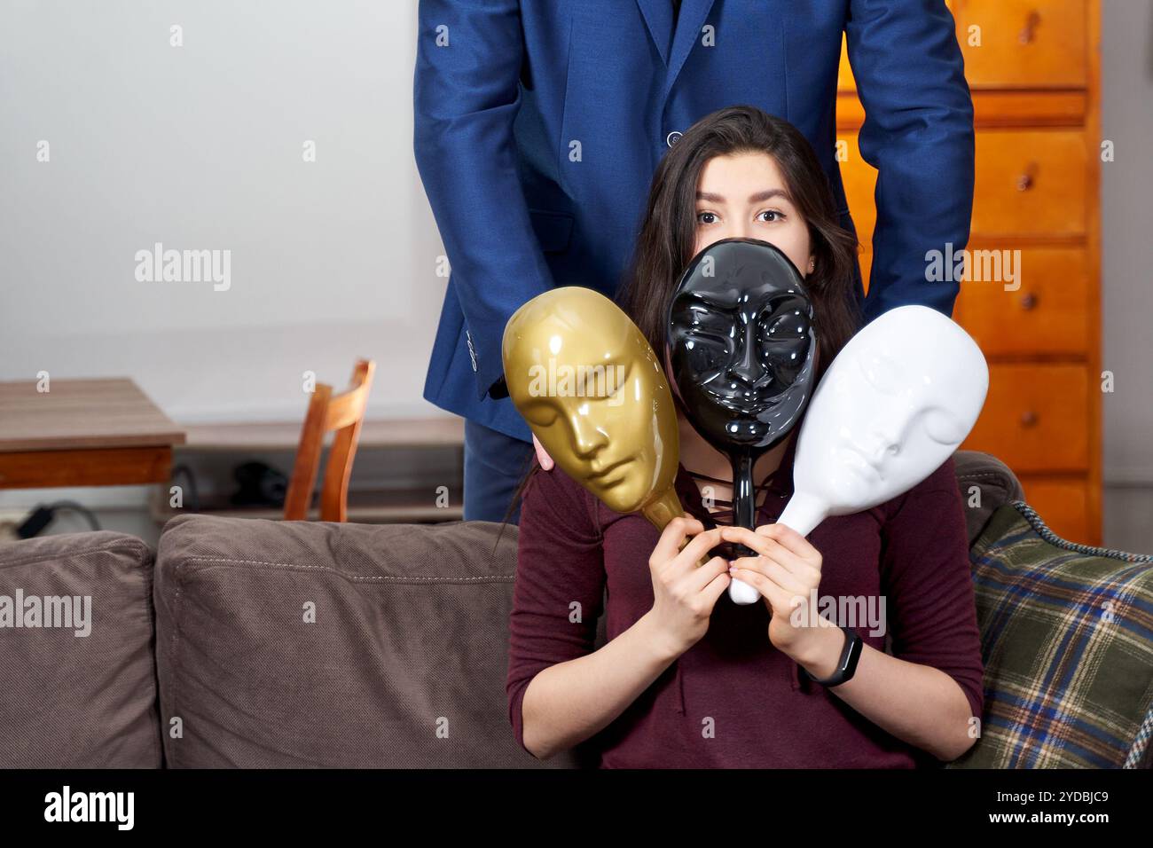 Therapist using plastic masks with female patient during therapy session Stock Photo