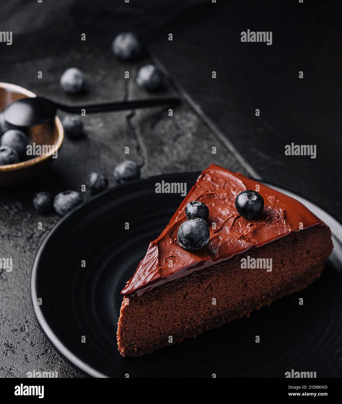 Chocolate brownie cakes with blueberry on plate Stock Photo - Alamy