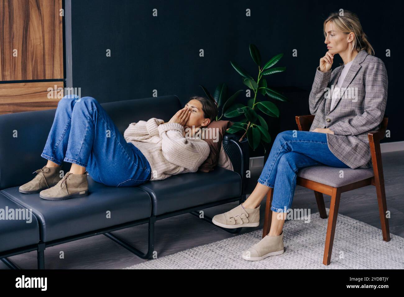 Crying patient lying on sofa hi-res stock photography and images - Alamy