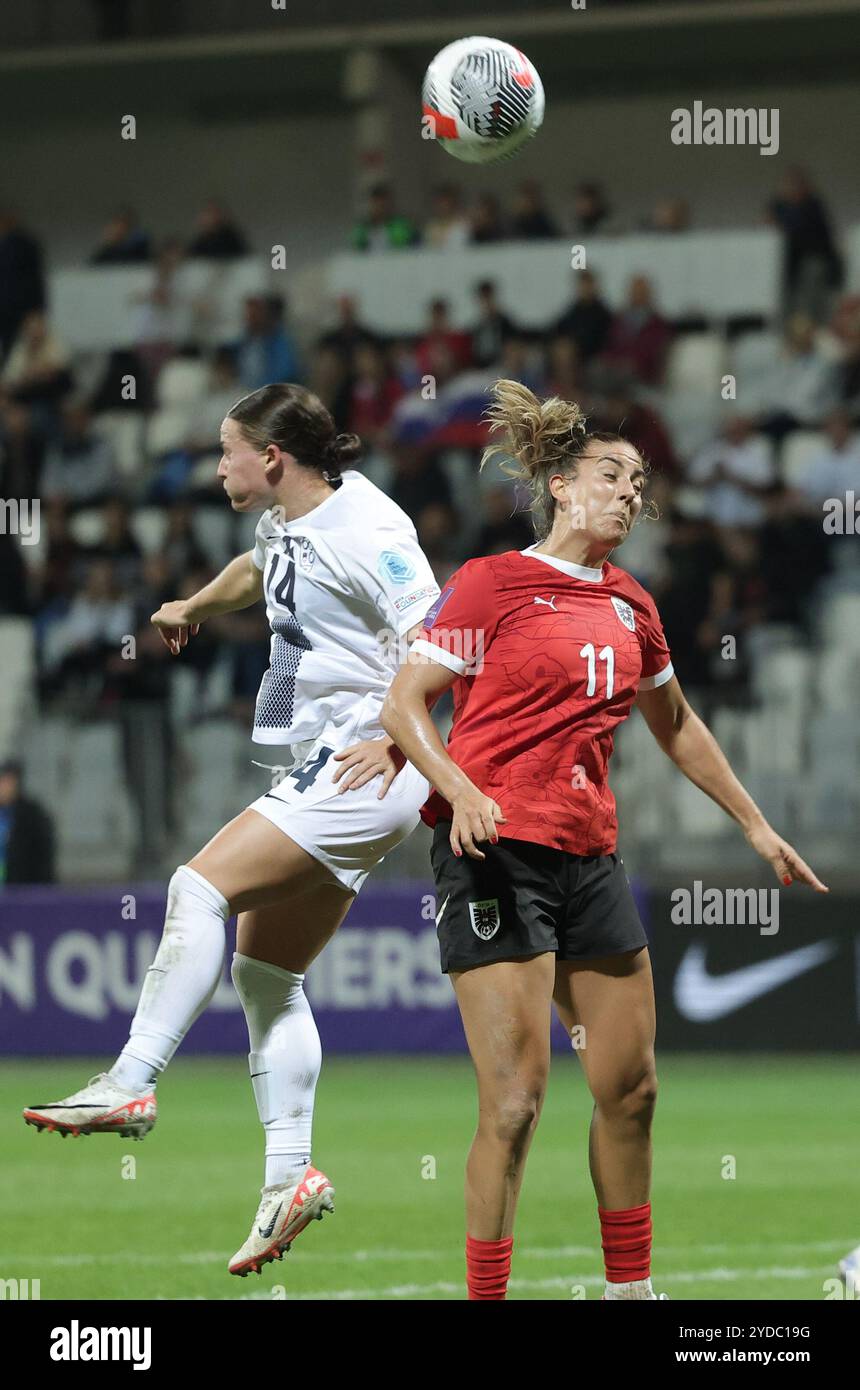 Koper, Slovenia. 25th Oct, 2024. Spela Kolbl (L) of Slovenia vies for a header with Marina Georgieva of Austria during the first leg match of the qualifier for the 2025 Women's European Football Championship between Slovenia and Austria in Koper, Slovenia, on Oct. 25, 2024. Credit: Zeljko Stevanic/Xinhua/Alamy Live News Stock Photo