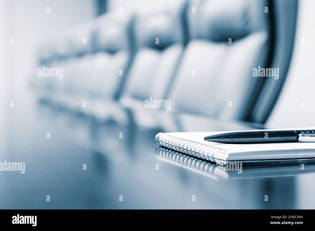 Closeup of notepad kept on table in empty room Stock Photo