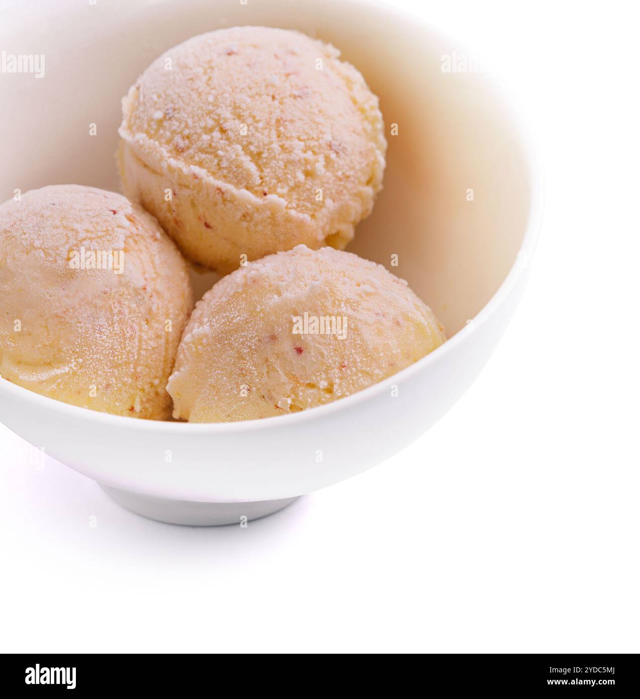 Three balls of vanilla-banana ice cream in white bowl Stock Photo