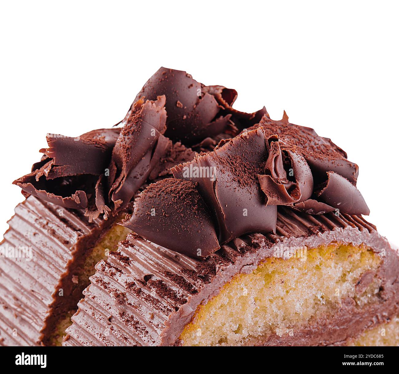 Chocolate roll with cream on a white plate Stock Photo