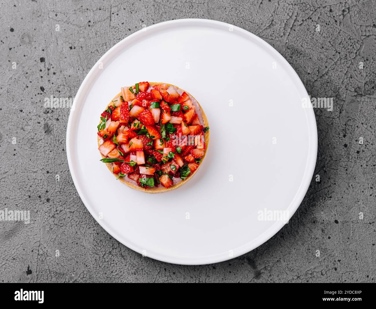 Strawberry tartlet on grey stone background Stock Photo