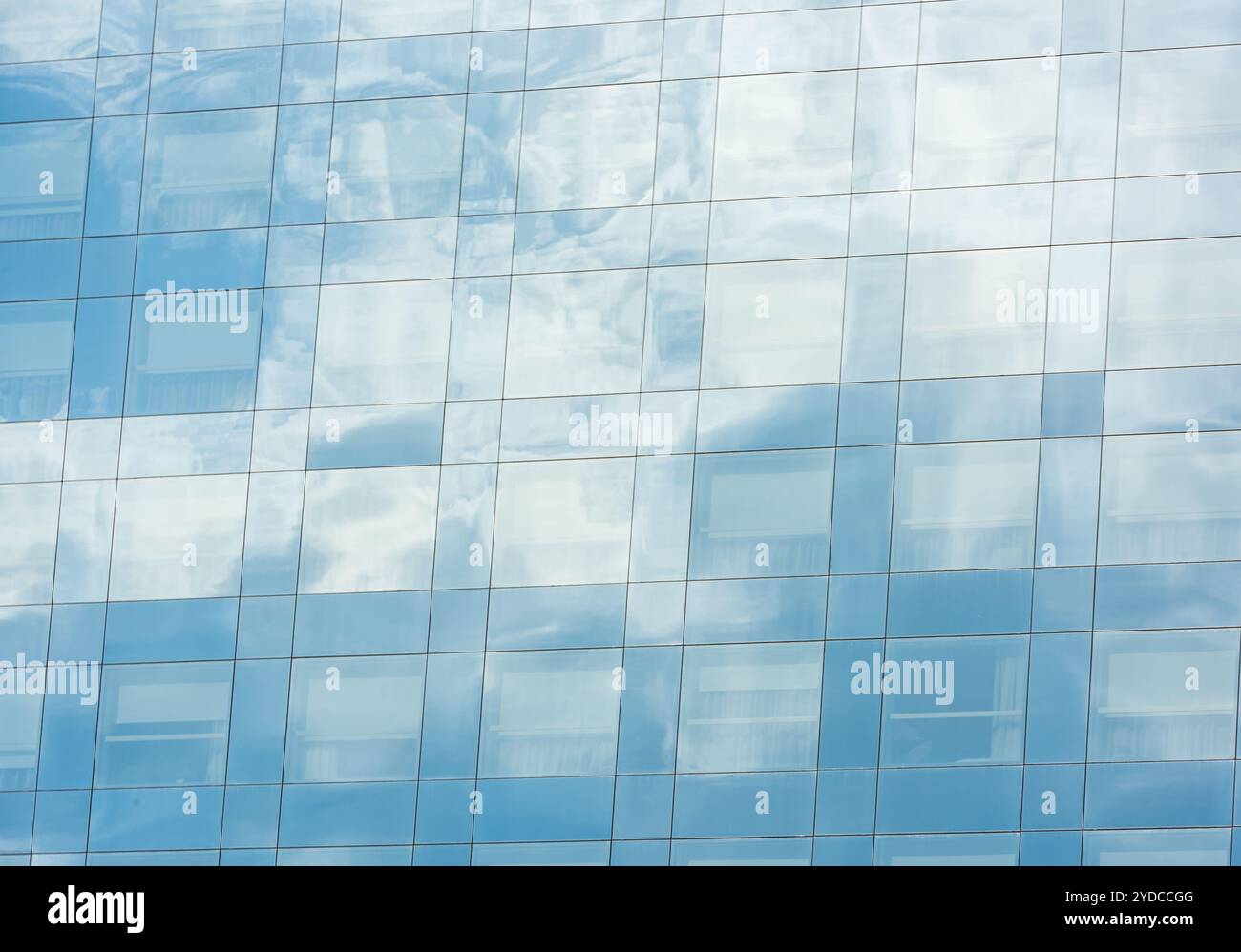 Blue sky and clouds reflected in office building Stock Photo - Alamy