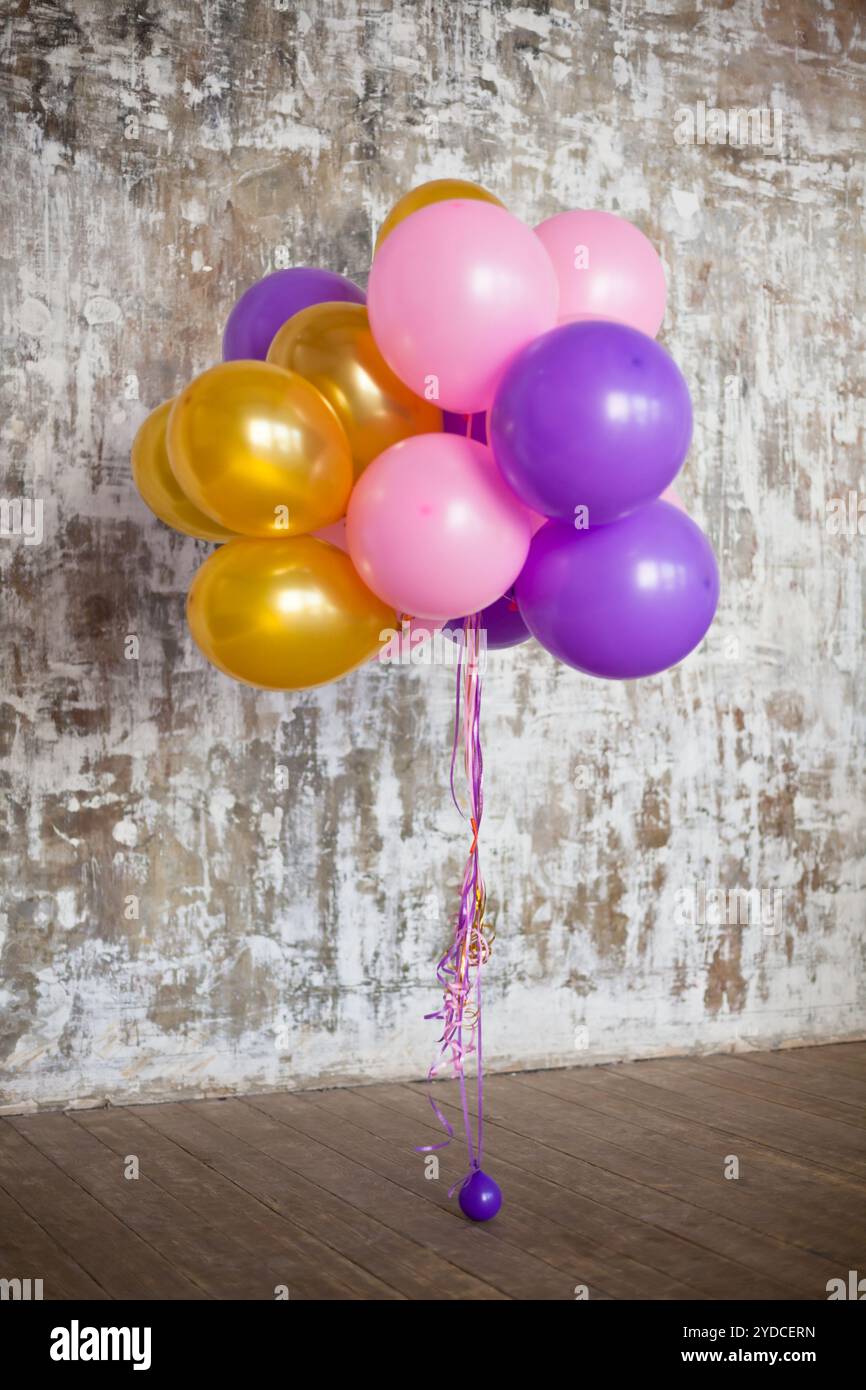 Bright balloons bunch against a textured wall Stock Photo - Alamy