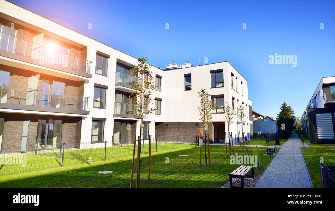Modern eco friendly apartment buildings with green trees. Modern ... - Eco Friendly Apartment Complex For Families With Disabilities