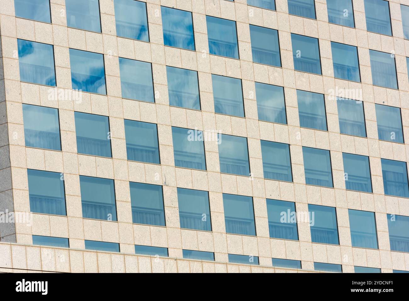 Blue sky and clouds reflected in office building Stock Photo - Alamy