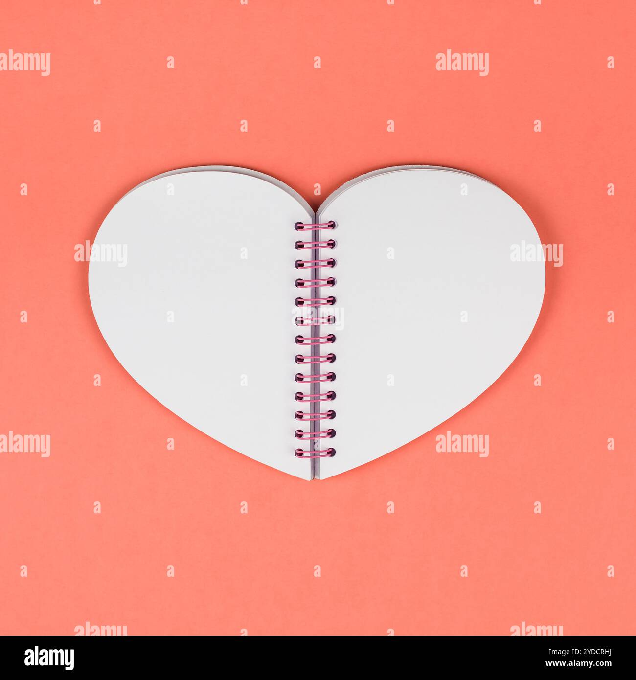 Blank heart shaped notepad on coral background Stock Photo - Alamy