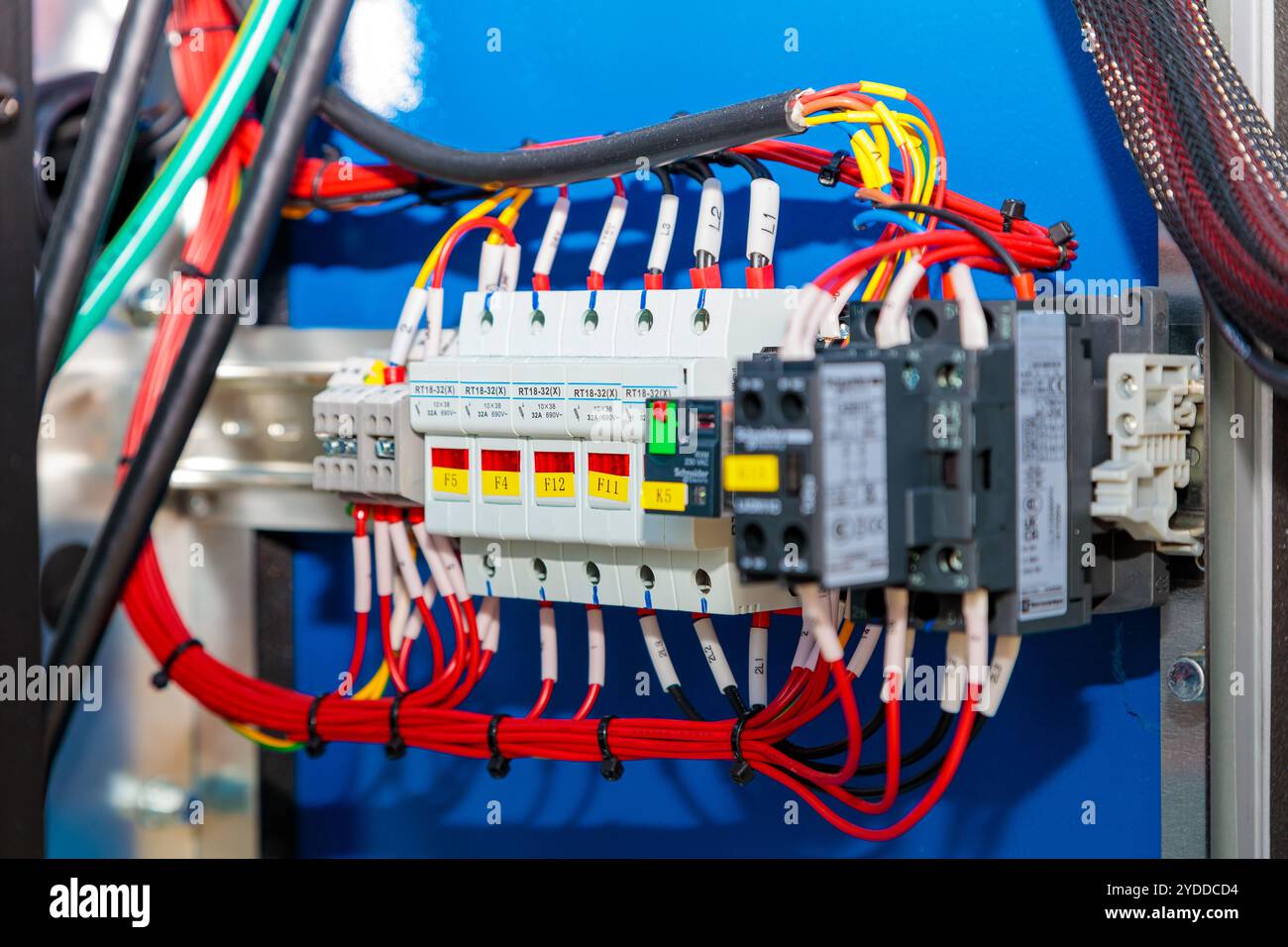 Electrical wiring, fuse and contactor connecting inside industrial control panel Stock Photo