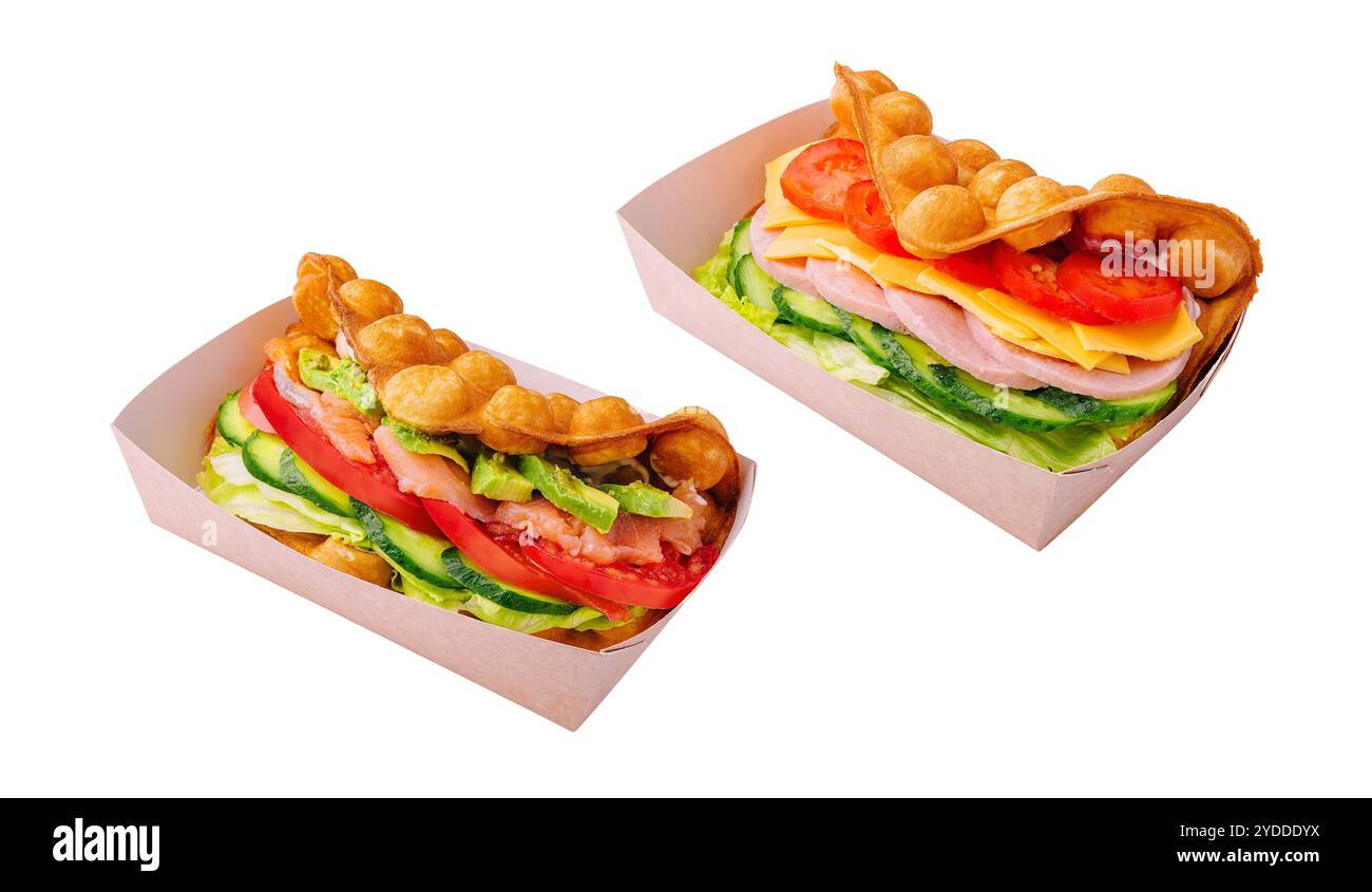 Belgian waffles with salmon, ham, avocado and salad on boxes Stock Photo