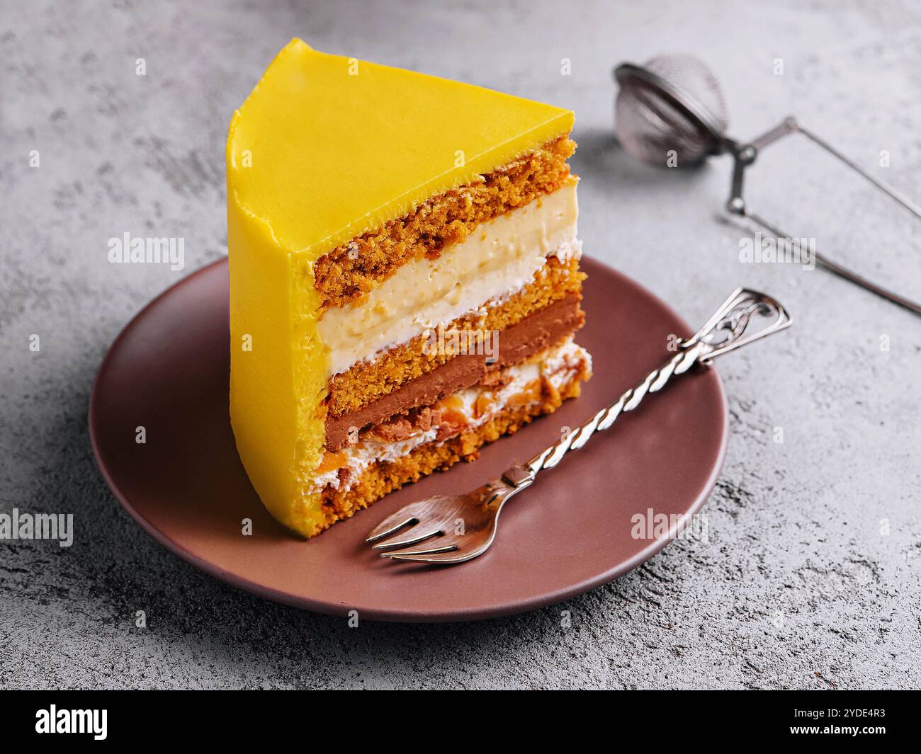 Tasty mango mousse cake on plate Stock Photo