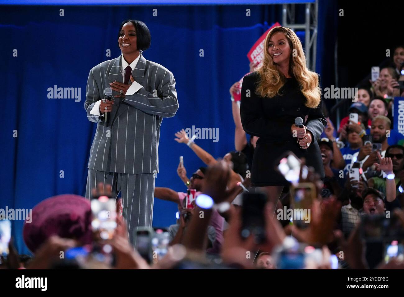 Kelly Rowland and Beyonce onstage during a campaign event at Shell ...