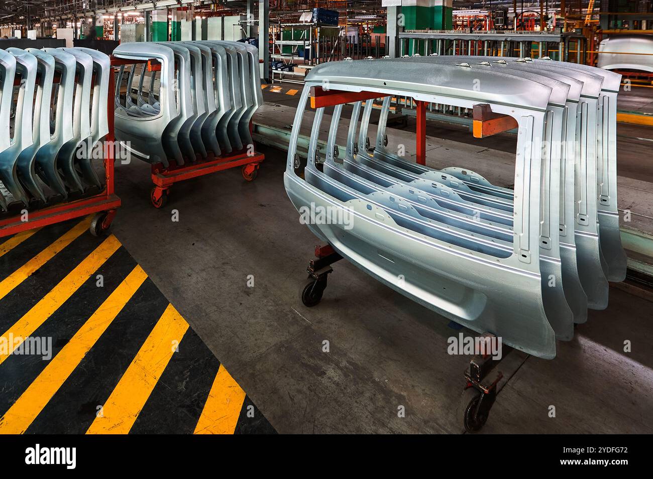 Automobile frames metal parts on assembling conveyor Stock Photo - Alamy