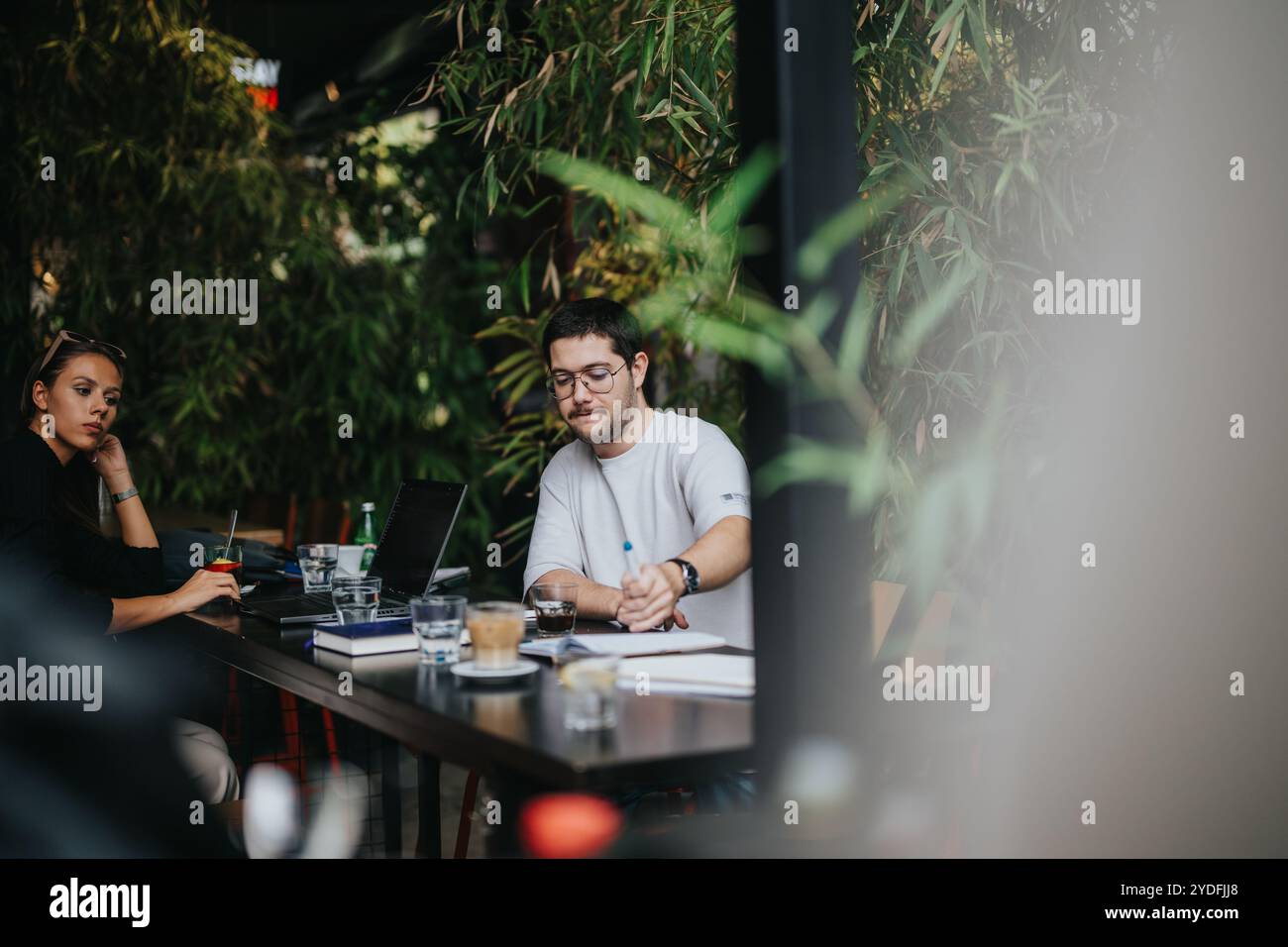 High school students studying together at a cozy coffee bar Stock Photo ...