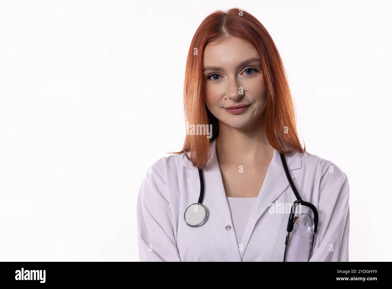 A confident female doctor dressed in a white coat and equipped with her ...
