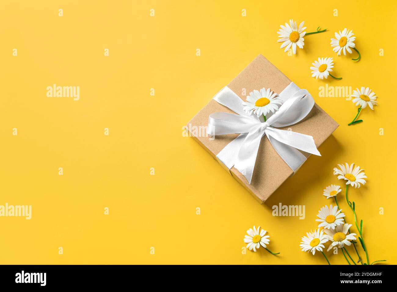Bright yellow gift box hi-res stock photography and images - Alamy