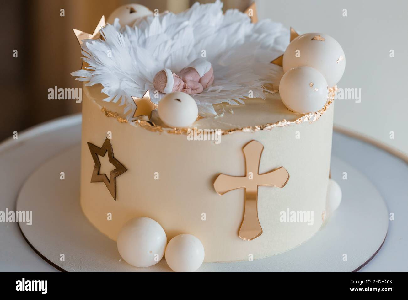 Elegant Christening Cake with Decorations and Baby Figurine Stock Photo — free download