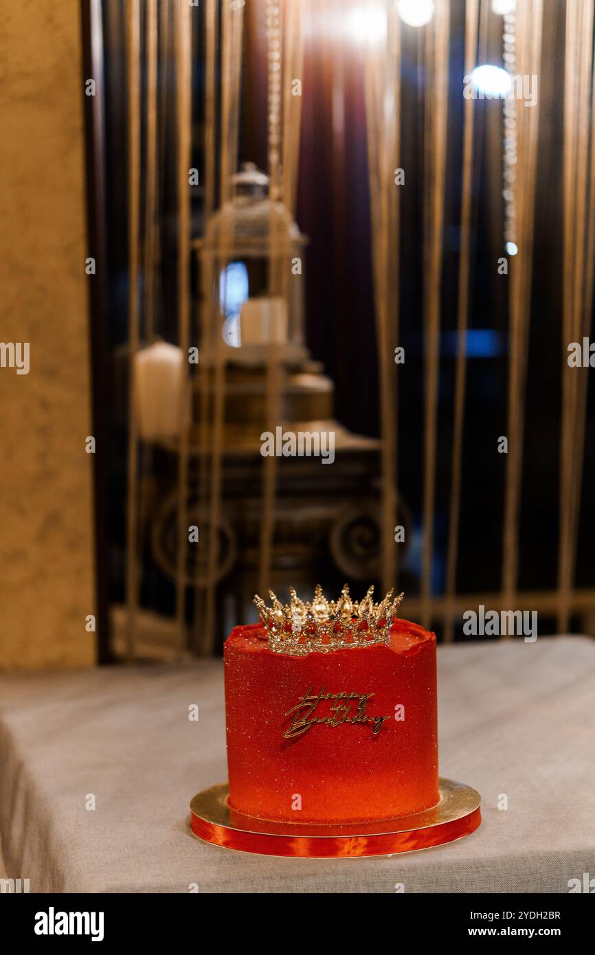Elegant Red Birthday Cake with Crown Decoration Stock Photo - Alamy