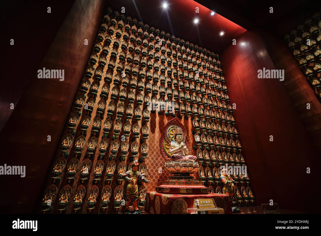 Singapore - August 16, 2024: Buddha Tooth Relic Temple, Chinatown, ornate gold interior, religious cultural landmark destination Stock Photo