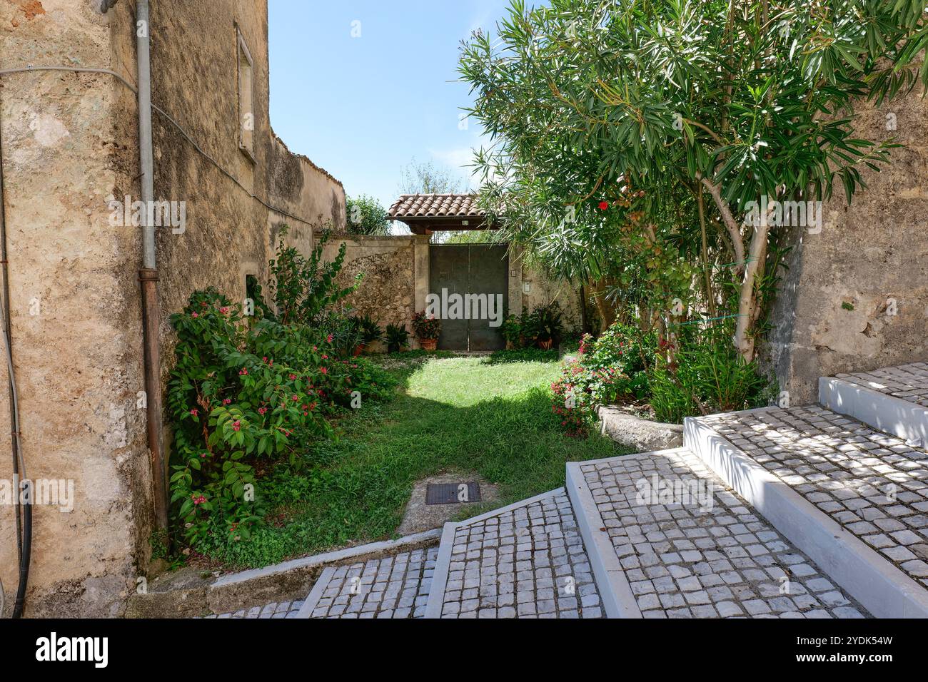 A small garden in front of an old house in Alvito, a medieval village ...