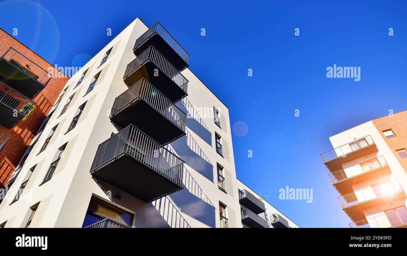 Image showcasing Modern multifamily building in a european city. Walls made of concrete ...