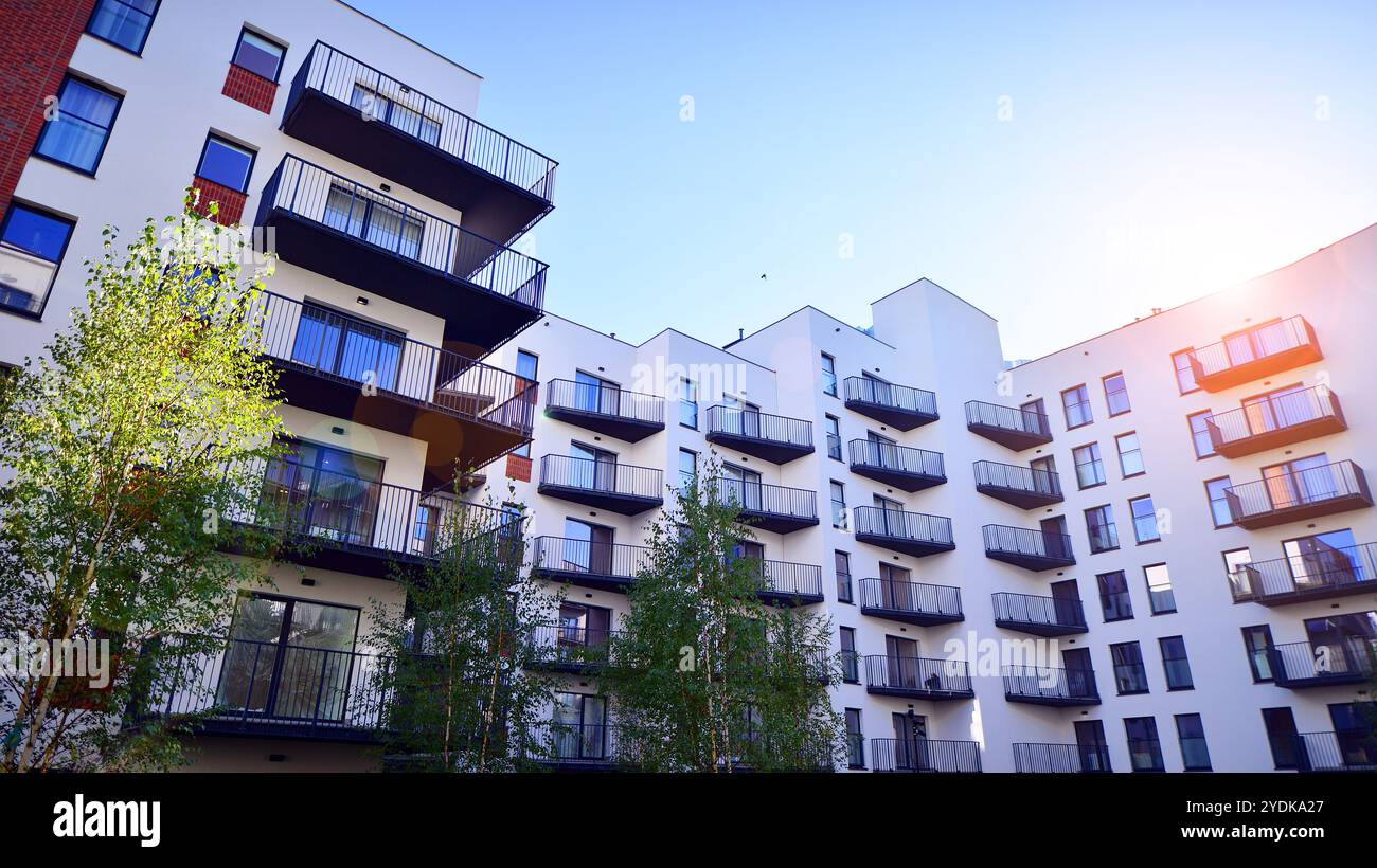 Image showcasing Modern multifamily building in a european city. Walls made of concrete ...