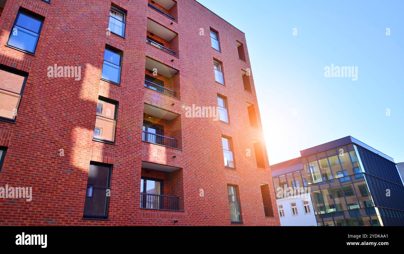 Image showcasing Modern multifamily building in a european city. Walls made of concrete ...