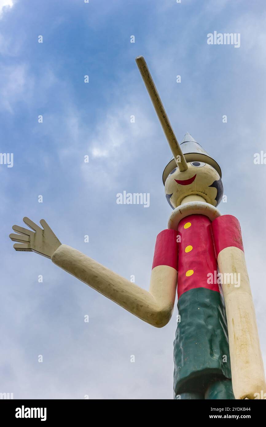 Statue of wooden boy Pinocchio with a long nose in Collodi, Italy Stock Photo