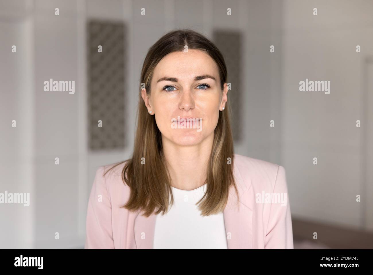 Young Caucasian business leader woman looking at camera Stock Photo
