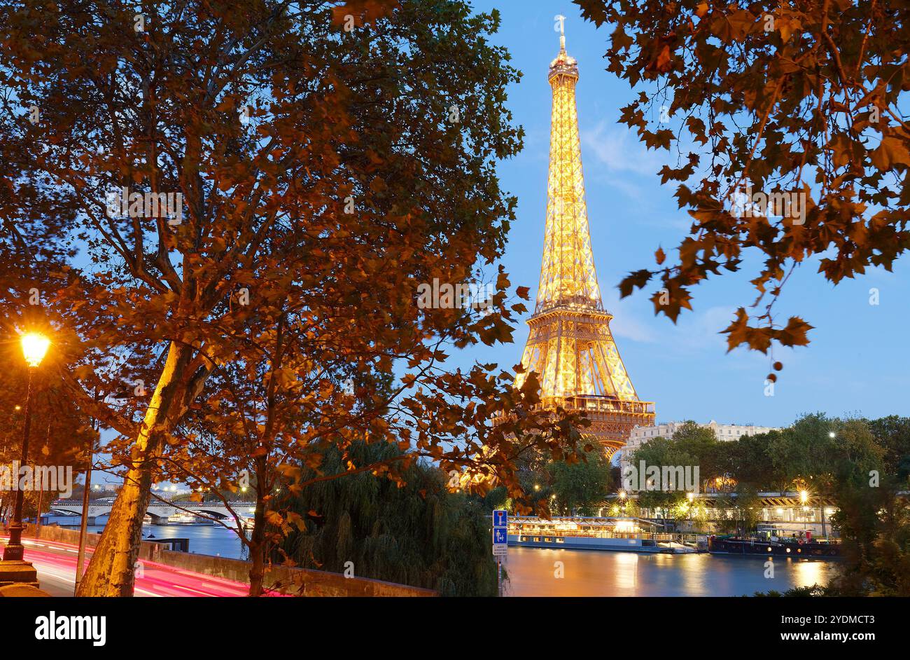 The view of the illuminated Eiffel Tower and the river Seine in Paris ...